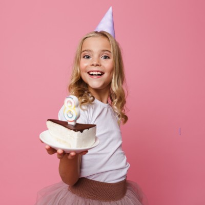 portrait-smiling-little-girl-birthday-hat 1.1.jpg